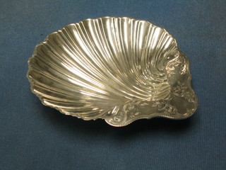 A Victorian engraved silver scallop shaped butter dish raised on 3 ball feet, London 1890, maker's mark GMJ 2 ozs