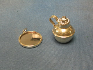 A miniature silver plated Jersey milk carrier and a miniature silver plated hand mirror