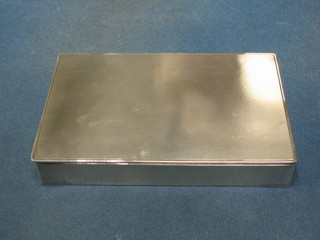 A rectangular silver cigarette box with solid hinged lid and engine turned decoration Birmingham 1937, 7"