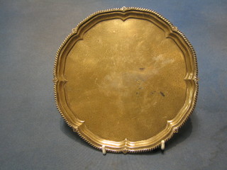 A silver salver with bracketed border, raised on 4 panel supports Sheffield 1931 11 ozs
