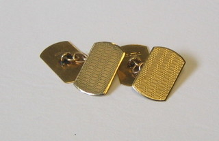 A pair of gentleman's 9ct gold cufflinks with engine turned decoration