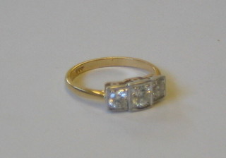 A lady's 18ct gold engagement/dress ring set 3 diamonds  approx (0.70ct)