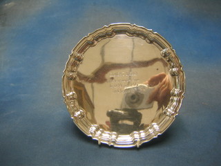 A silver salver with bracketed border raised on 3 scroll feet Sheffield 1934, 11 ozs (inscribed)