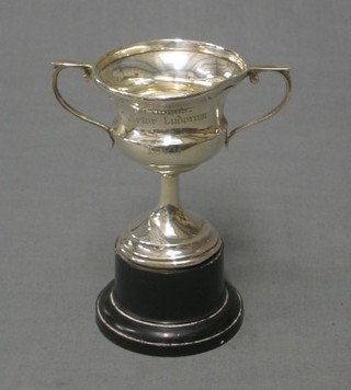 A silver twin handled trophy cup Birmingham 1939 (some dents and damage), 3"