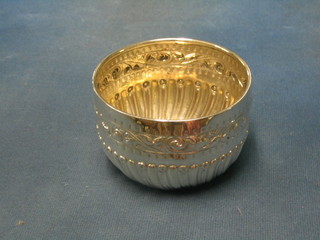 A Victorian circular embossed silver sugar bowl with demi-reeded decoration London 1886, 4 ozs