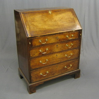 A Georgian mahogany bureau, the fall front revealing a well fitted interior above 4 long graduated drawers with brass swan neck drop handles, raised on bracket feet 33"