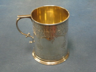 A Victorian engraved silver christening tankard with parcel gilt decoration, London 1871, 4 ozs
