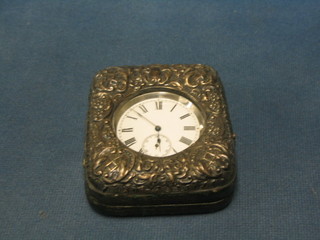 An Edwardian embossed silver travelling clock case Birmingham 1908 containing a silver plated open faced pocket watch (hinge f)