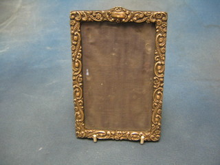 An Edwardian embossed silver easel photograph frame Chester 1901 7" x 4 1/2" (some holes)