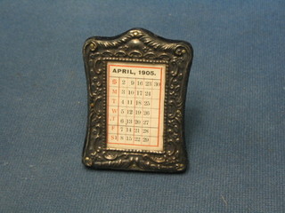 An Edwardian embossed silver easel desk calendar Birmingham 1904 containing a calendar for 1905 3"