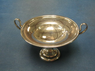 A circular Edwardian silver twin handled comport raised on a circular spreading foot Birmingham 1905 4 ozs