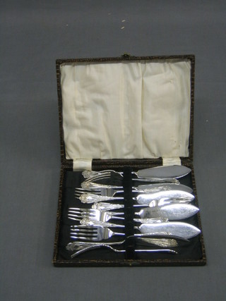 A set of 6 fine quality silver plated fish knives and forks, cased