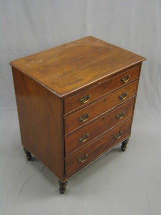A 19th Century mahogany chest of 4 long graduated drawers with brass plate drop handles, raised on turned supports 25"