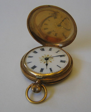 A lady's 18ct gold fob watch contained in an 18ct chased gold case