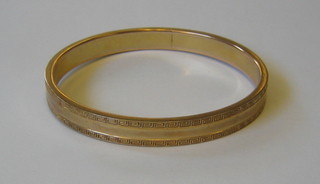 A 9ct gold bangle
