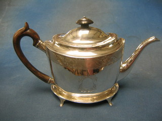 A George III oval silver teapot with engraved decoration together with a matching oval teapot stand, raised on 4 panel supports, London 1798, makers mark JW 17 ozs