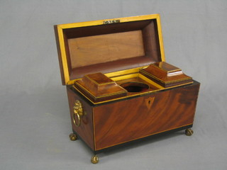 A handsome Georgian inlaid satinwood mahogany twin compartment tea caddy of sarcophagus form, the interior fitted 2 caddies with hinged lids (no mixing bowl) with brass lion mask handles, raised on ball and claw feet and shield escutcheon 13"