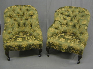 A pair of Victorian ebonised tub back armchairs upholstered in buttoned green Oriental style material