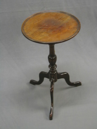 A circular Georgian style mahogany wine table on pillar and tripod supports 14"