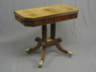 A Georgian bleached mahogany lozenge shaped tea table, raised on 4 column supports with platform base and scrolled feet, ending in brass caps and castors 36"