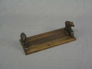 A pair of Swiss carved wooden expanding book ends 12"