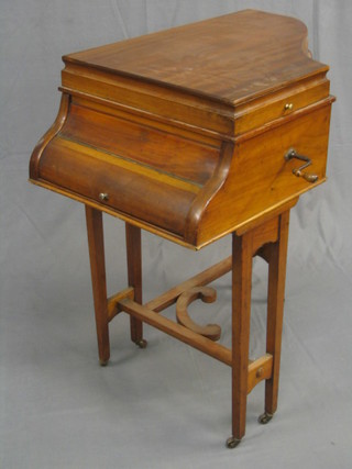 An Operaphone gramophone contained in a walnut cabinet in the form of a grand piano 29"