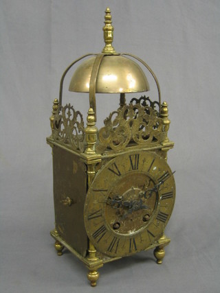 A 1930's striking brass cased lantern clock with Roman numerals and 5 1/2" dial (1 door missing)