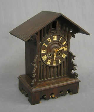 A 19th/20th Century Bavarian cuckoo clock contained in a carved case