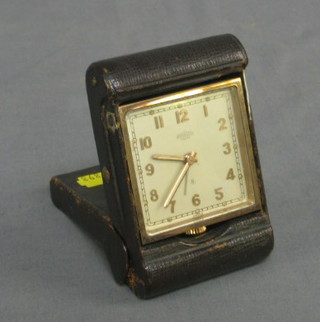 A 1930's 8 day travelling alarm clock