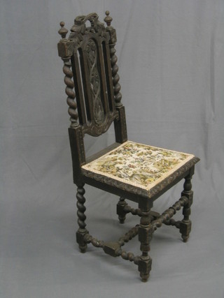A Victorian Carolean style carved oak standard chair