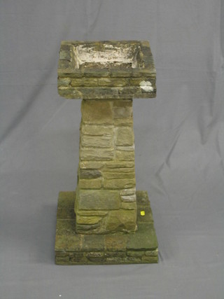 A 1930's well weathered garden bird bath raised on a square column 28"