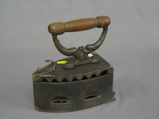 A 19th Century box iron with wooden handle