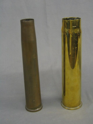 A brass anti-aircraft shell case and 1 other Continental shell case (2)