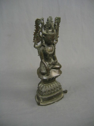 An 18th/19th Century Eastern bronze figure of a seated Deity 15"