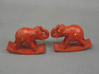 A pair of Indian red painted carved figures of elephants 6" 