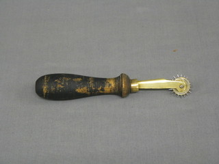 A 19th Century leather worker's brass wheel punch by Richardson with turned handle