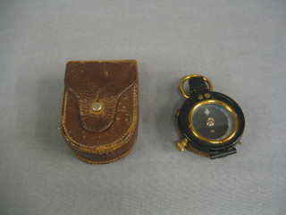 A WWI military prasmatic compass by Hughes & Sons Ltd dated 1914 complete with leather carrying case