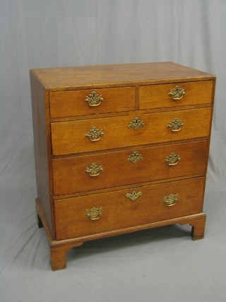 A 19th Century Country honey oak chest of 2 short and 3 long drawers with brass swan neck drop handles, raised on bracket feet 36"