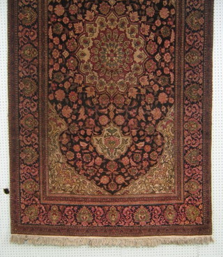 An old fine quality Persian carpet, pink ground with central medallion within multi-row borders 95" x 52"