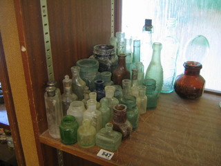 A collection of antique glass bottles