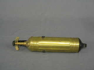 A brass car fire extinguisher