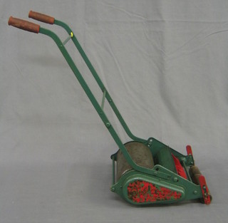 A childs metal Webb manual lawn mower