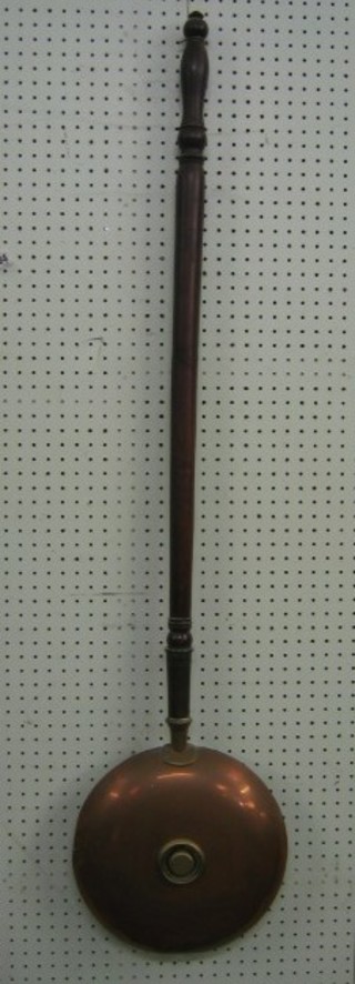 A 19th Century copper warming pan with turned fruitwood handle