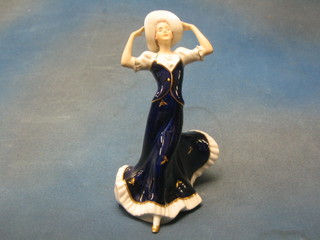 A Royal Dux figure of a bonnetted standing lady, the base with pink triangular Royal Dux mark 10"