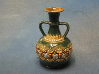 A Doulton Lambeth circular salt glazed twin handled vase, the base marked Doulton Lambeth and impressed NR, 5"