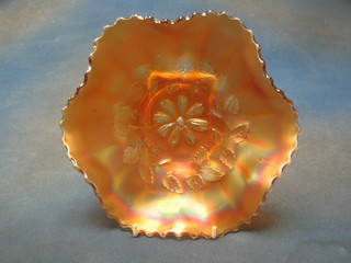 An orange Carnival glass dish with floral decoration 10"