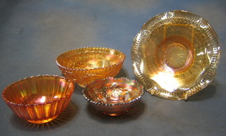 An orange Carnival glass dish decorated grapes 5", an orange Carnival glass bowl, a do. dish decorated flowers 7" and 1 other 5"