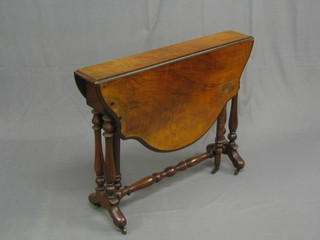 A Victorian shaped walnut Sutherland table, raised on turned supports with H framed stretcher 35"