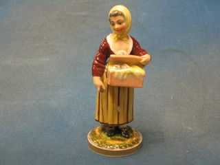 A 19th Century Continental porcelain figure of a lady street vendor (f) 7"