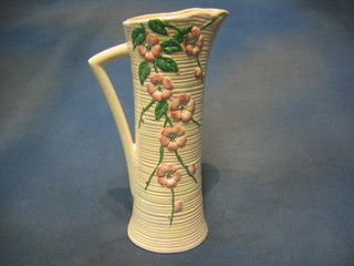 A Malingware (second?) waisted pottery jug with floral decoration, base marked Malingware (struck through) 656YM, 11"